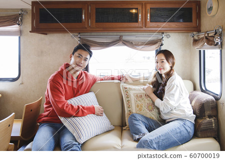 Happy young couple, camping or trip in Jeju, Korea 190 Happy young couple, camping or trip in Jeju, Korea 190 60700019