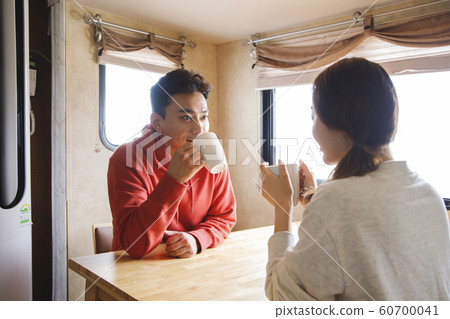 Happy young couple, camping or trip in Jeju, Korea 171 Happy young couple, camping or trip in Jeju, Korea 171 60700041