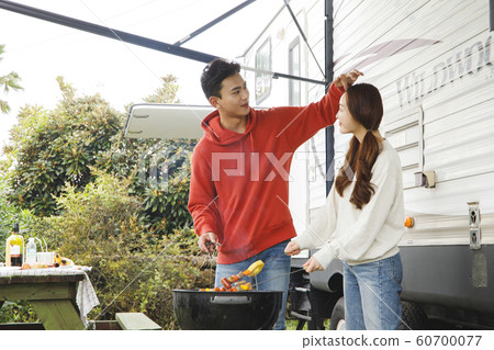 Happy young couple, camping or trip in Jeju, Korea 112 Happy young couple, camping or trip in Jeju, Korea 112 60700077