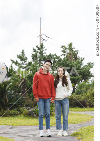 Happy young couple, camping or trip in Jeju, Korea 105 Happy young couple, camping or trip in Jeju, Korea 105 60700087