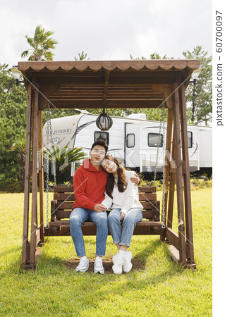 Happy young couple, camping or trip in Jeju, Korea 123 Happy young couple, camping or trip in Jeju, Korea 123 60700097