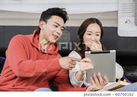 Happy young couple, camping or trip in Jeju, Korea 083 Happy young couple, camping or trip in Jeju, Korea 083 60700162