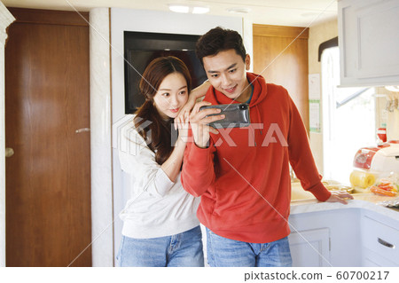 Happy young couple, camping or trip in Jeju, Korea 121 Happy young couple, camping or trip in Jeju, Korea 121 60700217