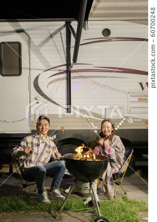 Happy young couple, camping or trip in Jeju, Korea 049 Happy young couple, camping or trip in Jeju, Korea 049 60700248