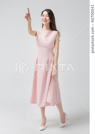 Happy single woman life, an attractive smiling woman holding shopping bags 338 Happy single woman life, an attractive smiling woman holding shopping bags 338 60700841
