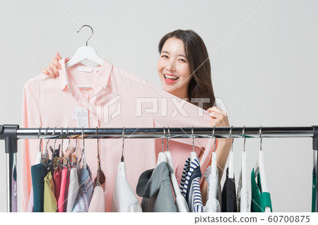 Happy single woman life, an attractive smiling woman holding shopping bags 367 Happy single woman life, an attractive smiling woman holding shopping bags 367 60700875
