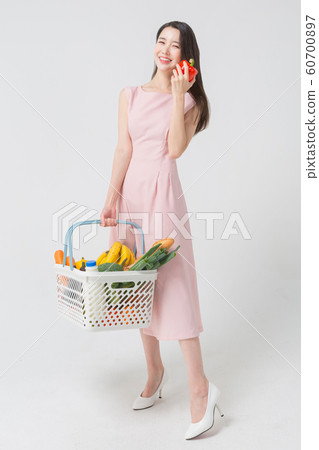 Happy single woman life, an attractive smiling woman holding shopping bags 424 Happy single woman life, an attractive smiling woman holding shopping bags 424 60700897