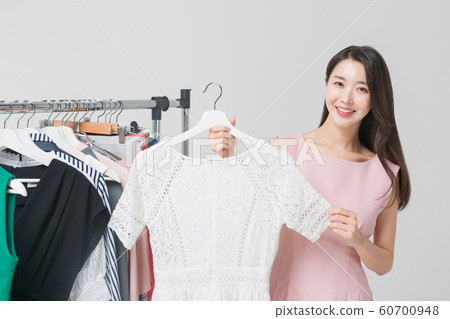Happy single woman life, an attractive smiling woman holding shopping bags 444 Happy single woman life, an attractive smiling woman holding shopping bags 444 60700948