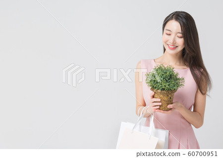 Happy single woman life, an attractive smiling woman holding shopping bags 297 Happy single woman life, an attractive smiling woman holding shopping bags 297 60700951
