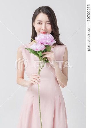 Happy single woman life, an attractive smiling woman holding shopping bags 333 Happy single woman life, an attractive smiling woman holding shopping bags 333 60700953
