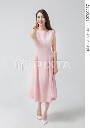 Happy single woman life, an attractive smiling woman holding shopping bags 310 60700967