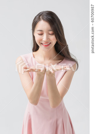Happy single woman life, an attractive smiling woman holding shopping bags 323 Happy single woman life, an attractive smiling woman holding shopping bags 323 60700987