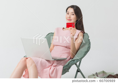 Happy single woman life, an attractive smiling woman holding shopping bags 315 Happy single woman life, an attractive smiling woman holding shopping bags 315 60700989