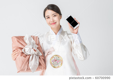 Happy single woman life, an attractive smiling woman holding shopping bags 195 Happy single woman life, an attractive smiling woman holding shopping bags 195 60700990