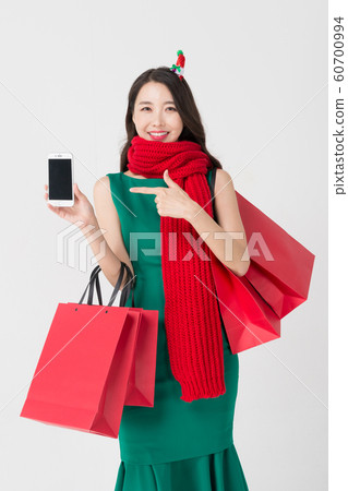 Happy single woman life, an attractive smiling woman holding shopping bags 186 Happy single woman life, an attractive smiling woman holding shopping bags 186 60700994