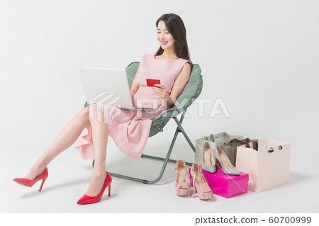 Happy single woman life, an attractive smiling woman holding shopping bags 276 Happy single woman life, an attractive smiling woman holding shopping bags 276 60700999