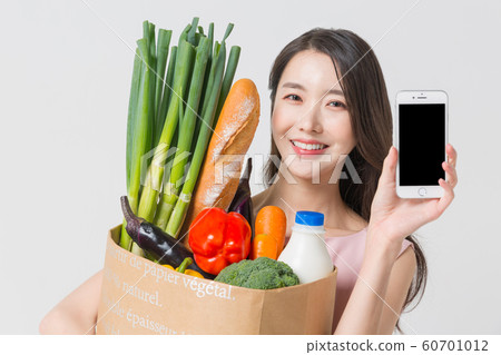 Happy single woman life, an attractive smiling woman holding shopping bags 402 60701012