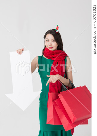 Happy single woman life, an attractive smiling woman holding shopping bags 189 Happy single woman life, an attractive smiling woman holding shopping bags 189 60701022