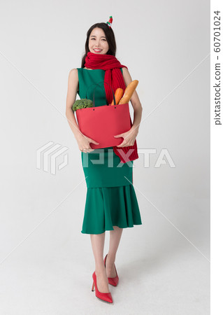 Happy single woman life, an attractive smiling woman holding shopping bags 183 Happy single woman life, an attractive smiling woman holding shopping bags 183 60701024
