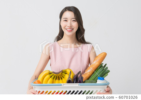 Happy single woman life, an attractive smiling woman holding shopping bags 374 Happy single woman life, an attractive smiling woman holding shopping bags 374 60701026