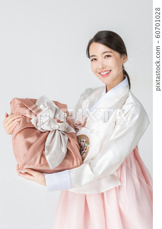 Happy single woman life, an attractive smiling woman holding shopping bags 253 60701028