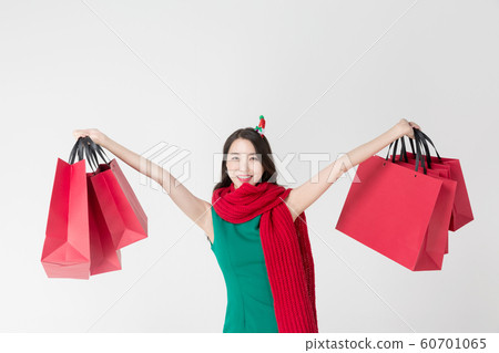 Happy single woman life, an attractive smiling woman holding shopping bags 158 Happy single woman life, an attractive smiling woman holding shopping bags 158 60701065