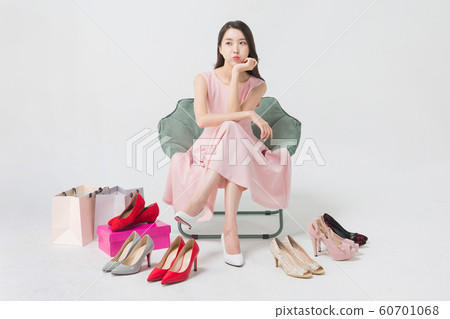 Happy single woman life, an attractive smiling woman holding shopping bags 345 Happy single woman life, an attractive smiling woman holding shopping bags 345 60701068