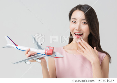 Happy single woman life, an attractive smiling woman holding shopping bags 304 Happy single woman life, an attractive smiling woman holding shopping bags 304 60701087