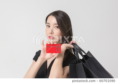 Happy single woman life, an attractive smiling woman holding shopping bags 120 60701090
