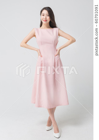 Happy single woman life, an attractive smiling woman holding shopping bags 301 Happy single woman life, an attractive smiling woman holding shopping bags 301 60701091