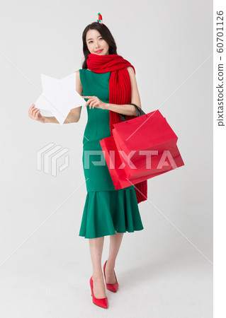 Happy single woman life, an attractive smiling woman holding shopping bags 176 Happy single woman life, an attractive smiling woman holding shopping bags 176 60701126