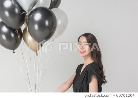 Happy single woman life, an attractive smiling woman holding shopping bags 099 Happy single woman life, an attractive smiling woman holding shopping bags 099 60701204