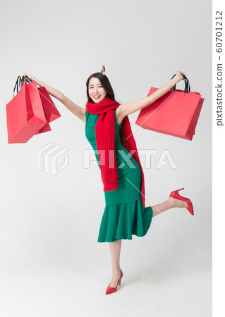 Happy single woman life, an attractive smiling woman holding shopping bags 163 Happy single woman life, an attractive smiling woman holding shopping bags 163 60701212