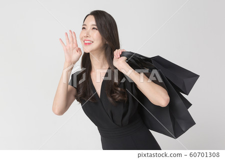 Happy single woman life, an attractive smiling woman holding shopping bags 071 60701308