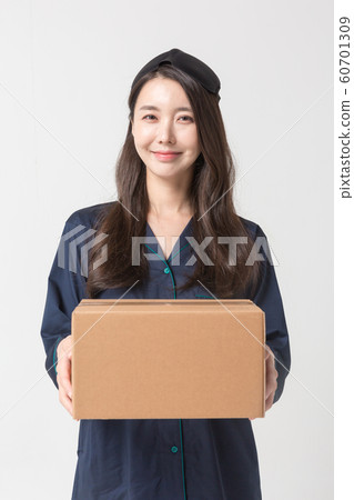 Happy single woman life, an attractive smiling woman holding shopping bags 001 60701309