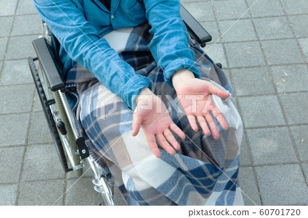 Disabled handicapped man sitting on wheelchair 137 Disabled handicapped man sitting on wheelchair 137 60701720