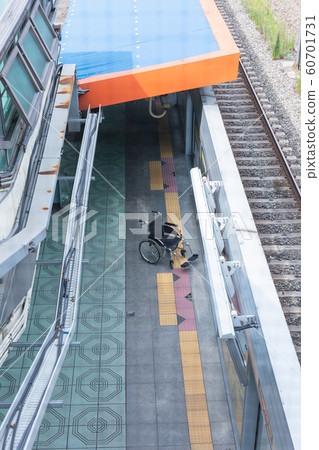 Disabled handicapped man sitting on wheelchair 101 Disabled handicapped man sitting on wheelchair 101 60701731
