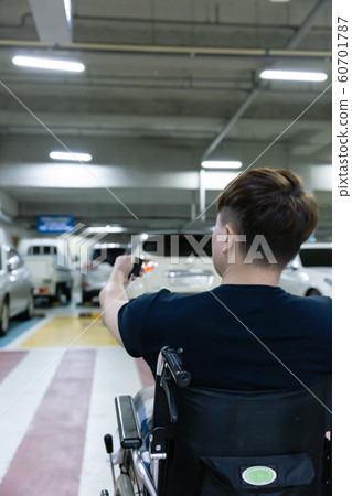 Disabled handicapped man sitting on wheelchair 028 Disabled handicapped man sitting on wheelchair 028 60701787