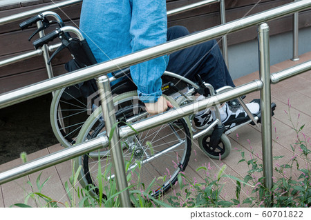 Disabled handicapped man sitting on wheelchair 011 Disabled handicapped man sitting on wheelchair 011 60701822