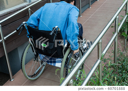 Disabled handicapped man sitting on wheelchair 102 Disabled handicapped man sitting on wheelchair 102 60701888