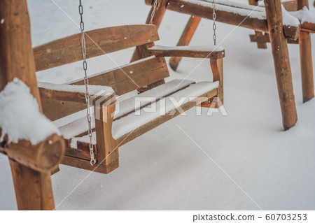 Benches in the winter city park which has been filled up with snow Benches in the winter city park which has been filled up with snow 60703253