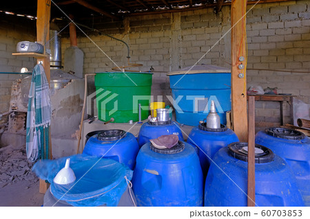 Illegal handmade artesanal sugar cane cachaca distillery near Santa Cruz Cabralia, Bahia, Brazil Illegal handmade artesanal sugar cane cachaca distillery near Santa Cruz Cabralia, Bahia, Brazil 60703853