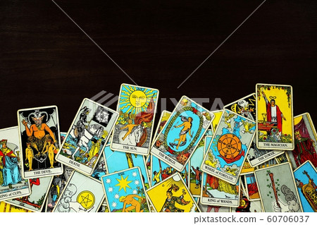 A pile deck of Tarot cards gypsy inspired on a wooden 60706037