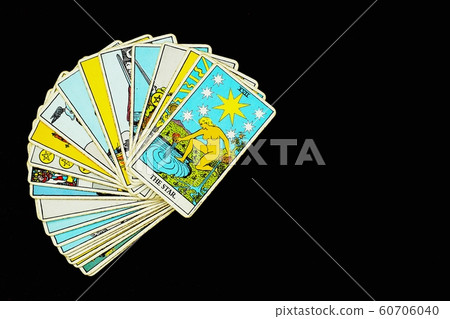 A pile deck of Tarot cards gypsy inspired on a wooden 60706040