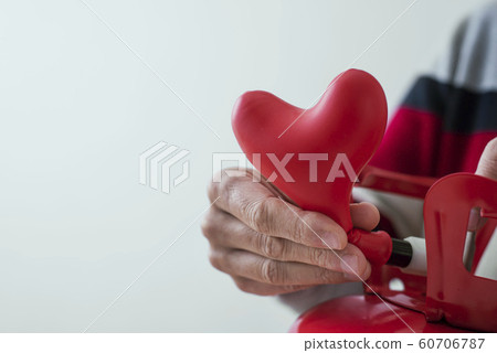inflating a heart-shaped balloon from a cylinder inflating a heart-shaped balloon from a cylinder 60706787