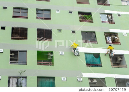 painters hanging on roll, painting color on wall. 60707459