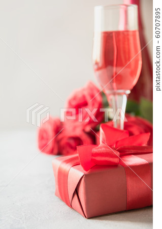 Romantic red gift, champagne, red roses. Love. 60707895
