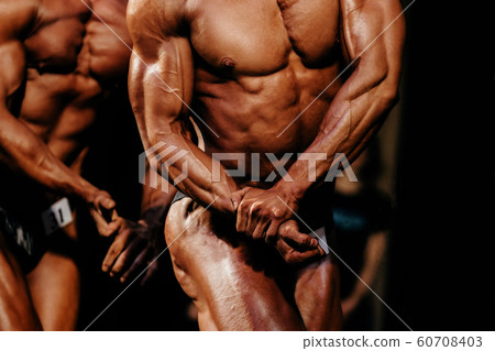 athlete bodybuilder posing biceps on hand athlete bodybuilder posing biceps on hand 60708403