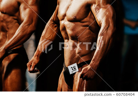 athlete man bodybuilder posing 60708404