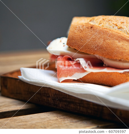 Italian sandwich with Parma's ham and mozzarella 60709397